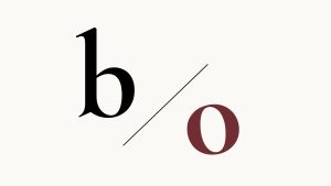 Typography showing a b in black and o in oxblood, divided by a black line.